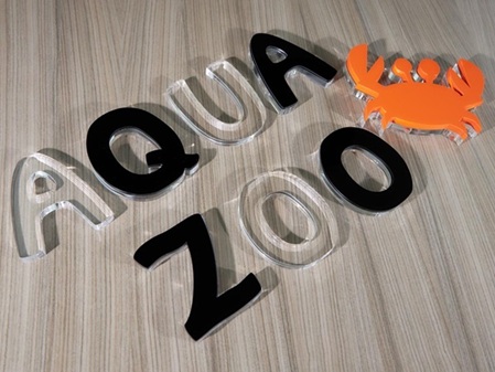 Acrylglas Buchstaben Muster farblos klar Sandwich schwarz orange